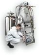 Engineer servicing a Tesla superconducting magnet